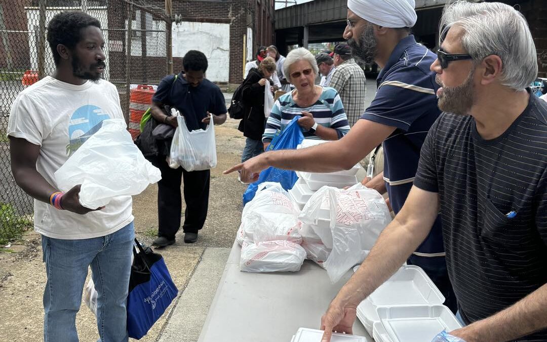 Volunteers from different faith groups at the monthly food service today in Wilmington. – June 29, 2024